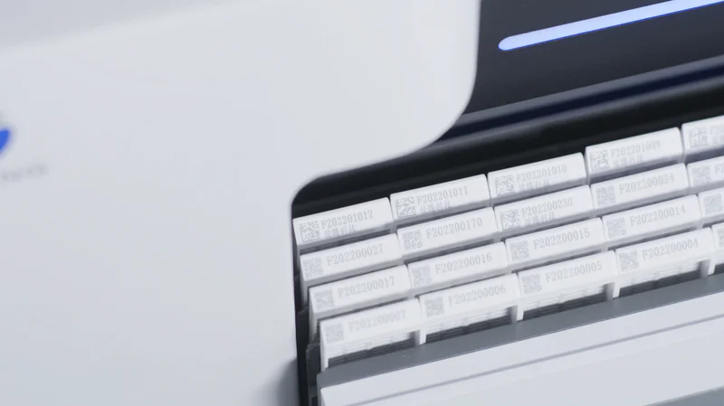 UV laser marking clear text and QR codes on a tissue cassette