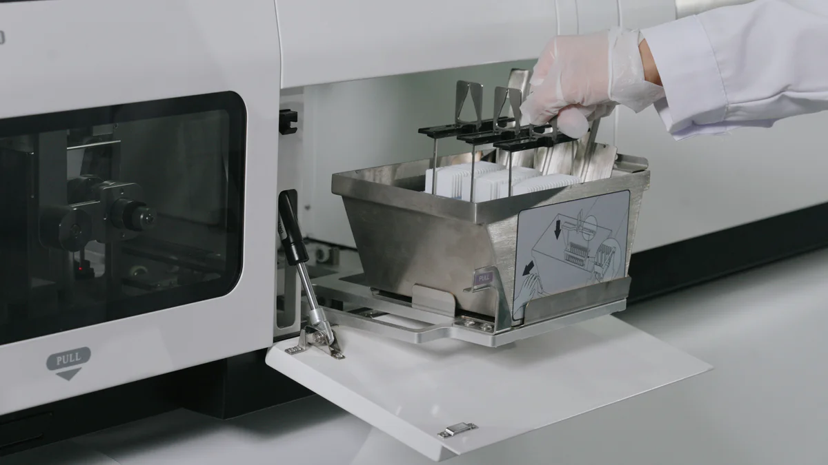 Loading stained slide rack into the coverslipper