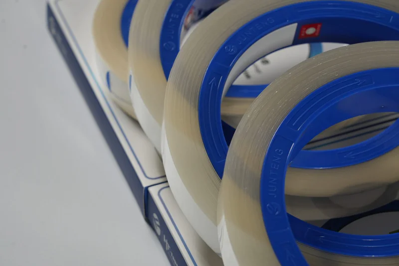 Technician handling film coverslipped slides without glass coverslips